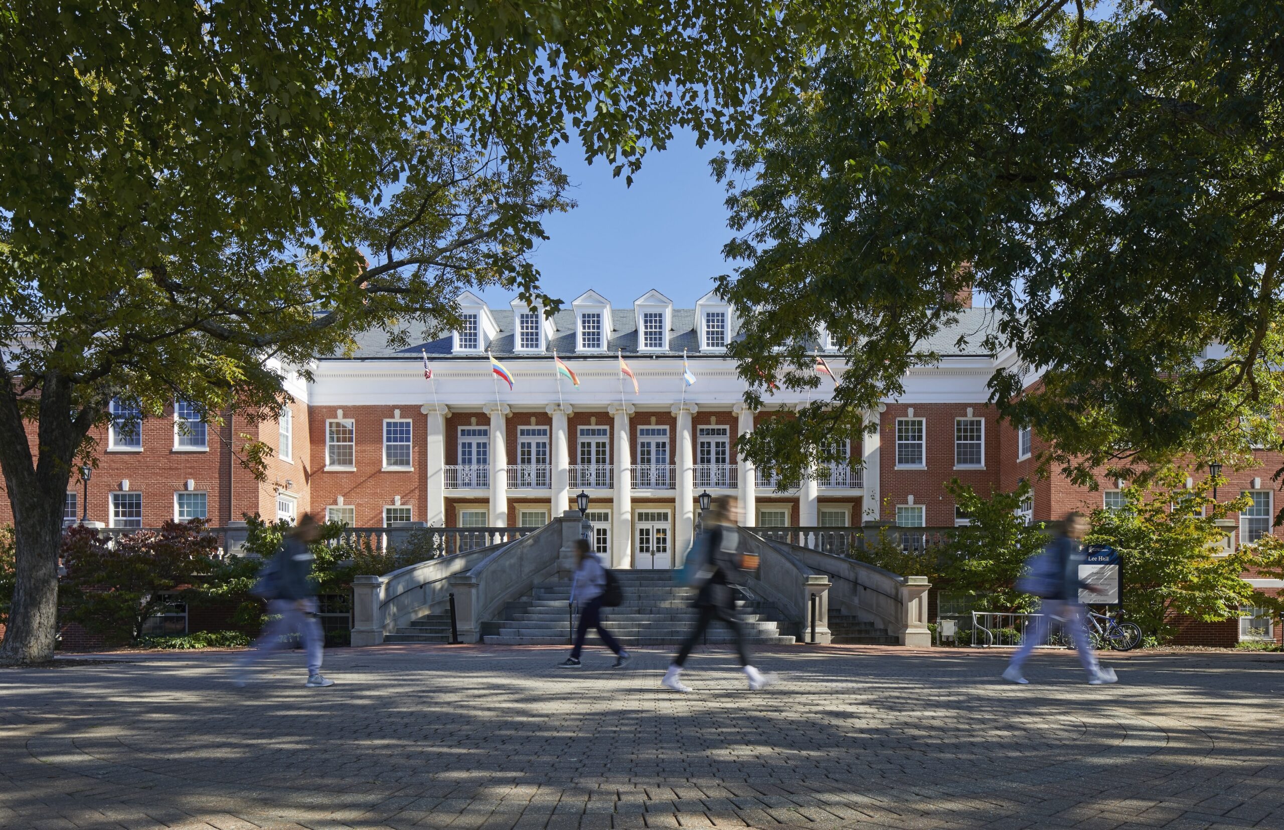 front view of Lee Hall with students walking by