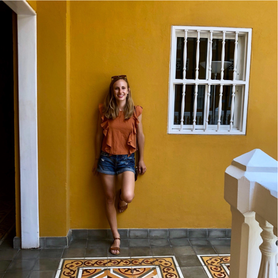 Brooke leaning on wall